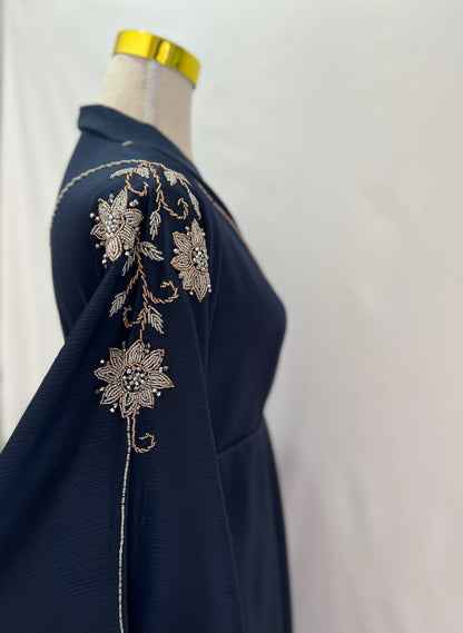 Lana Abaya, side view, showcase beadwork, close up, upper body only