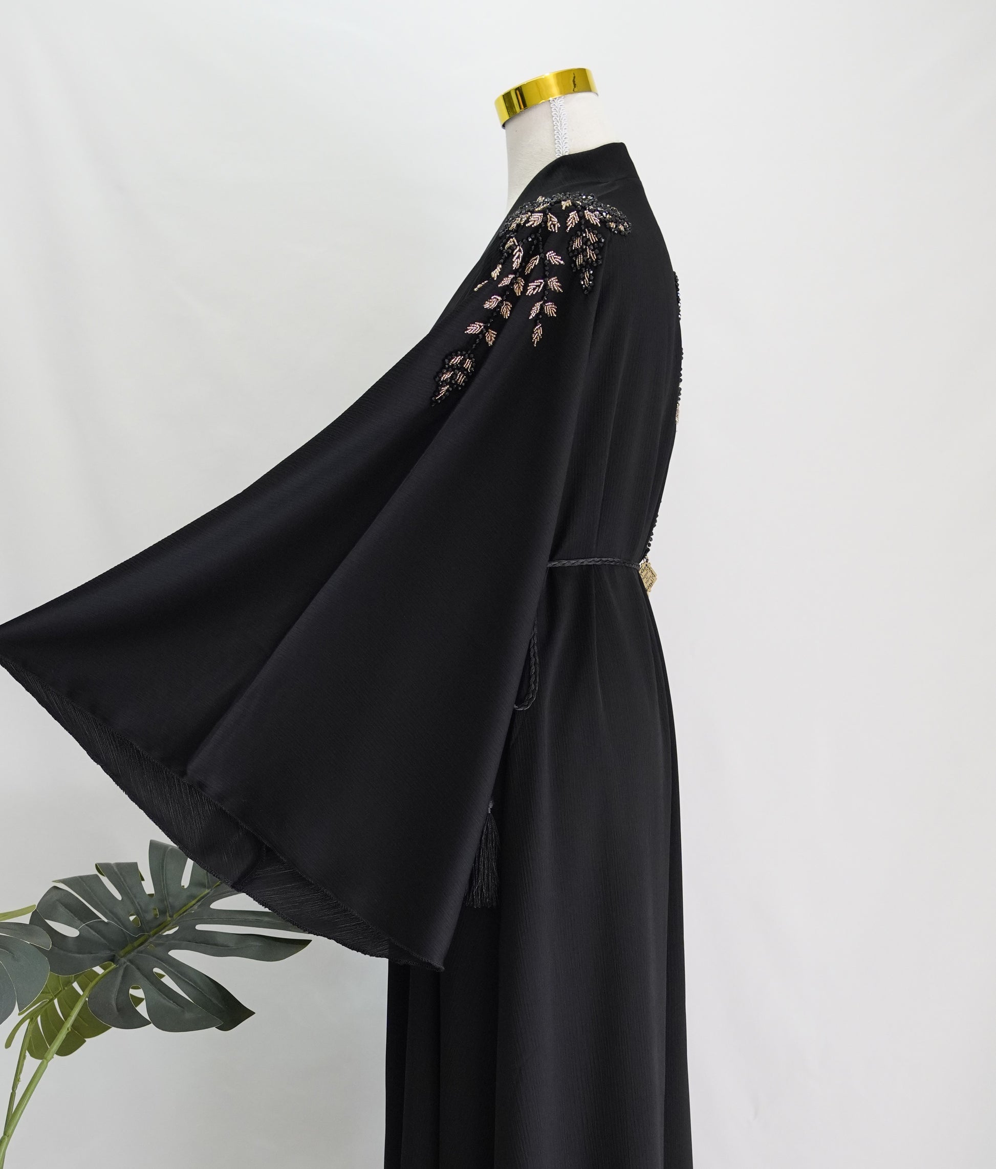 Zaynaa Abaya, side view, bell sleeve, close up, upper body only